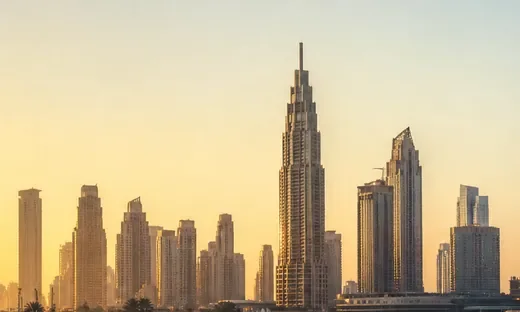 The Downtown Dubai towers in haze, the Burj Khalifa centre (AI-generated image)
